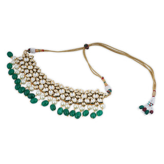 Festive outfit deserves outstanding accessories just like our kundan studden choker set with pearl and green drops.